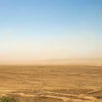 Defocused,Image.,Desert,Sandstorm.,Dust,And,Sand,In,The,Air.